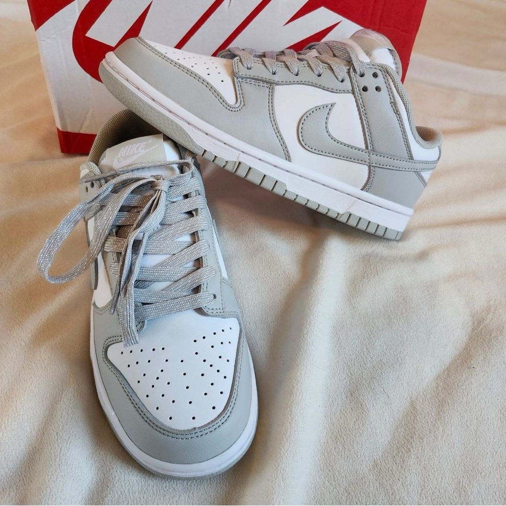 New in box.   No tag.  Size 8.5 women’s grey Nike dunk low retro